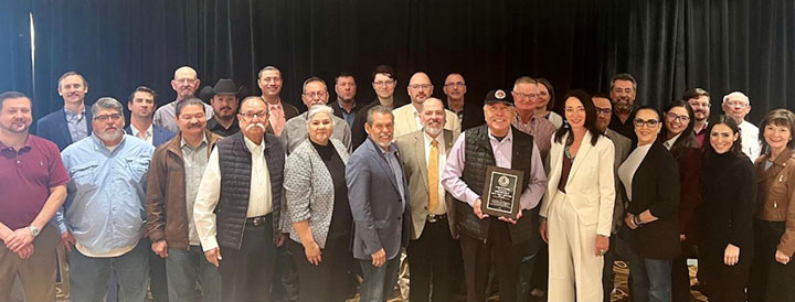 Photo: Sen. Hinojosa receiving his award while posing with members of the Border Prosecution Unit