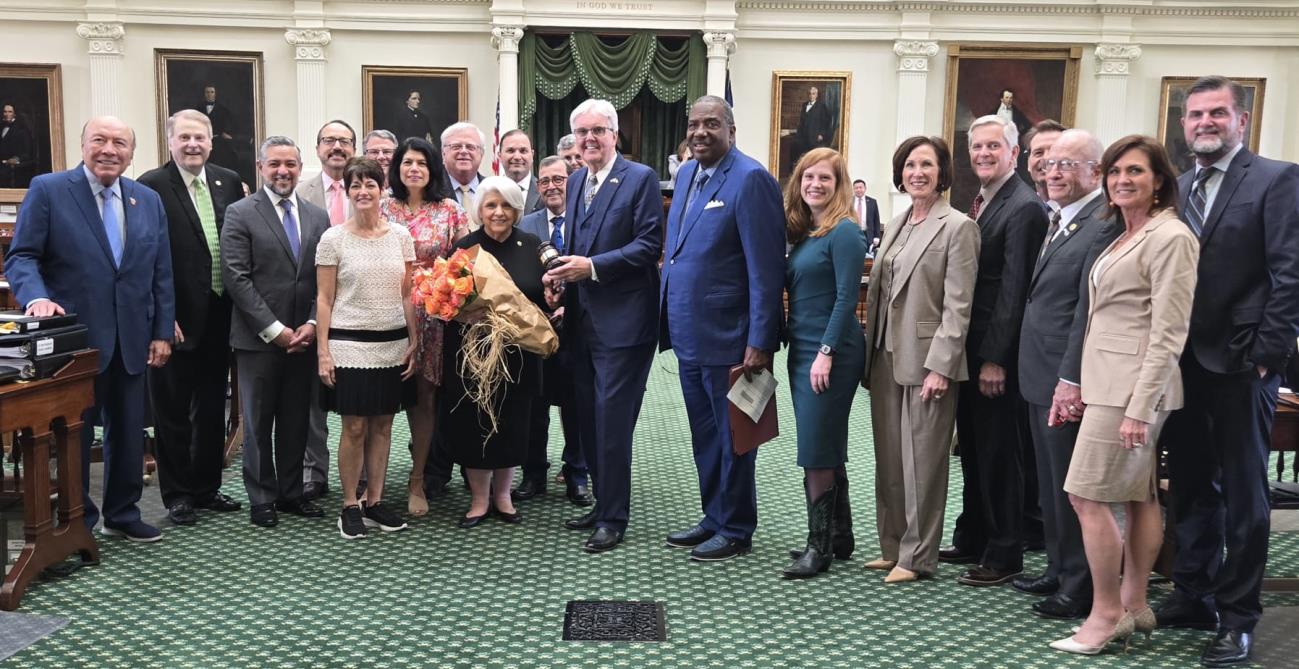 Photo: Dean Senator Judith Zaffirini joins Lt. Gov. Dan Patrick and her Senate colleagues to celebrate her 75000th consecutive vote.