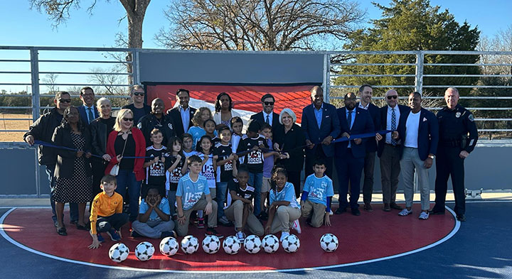 Photo: Dean Senator Judith Zaffirini poses with community leaders and young athletes at the opening of the mini-pitch